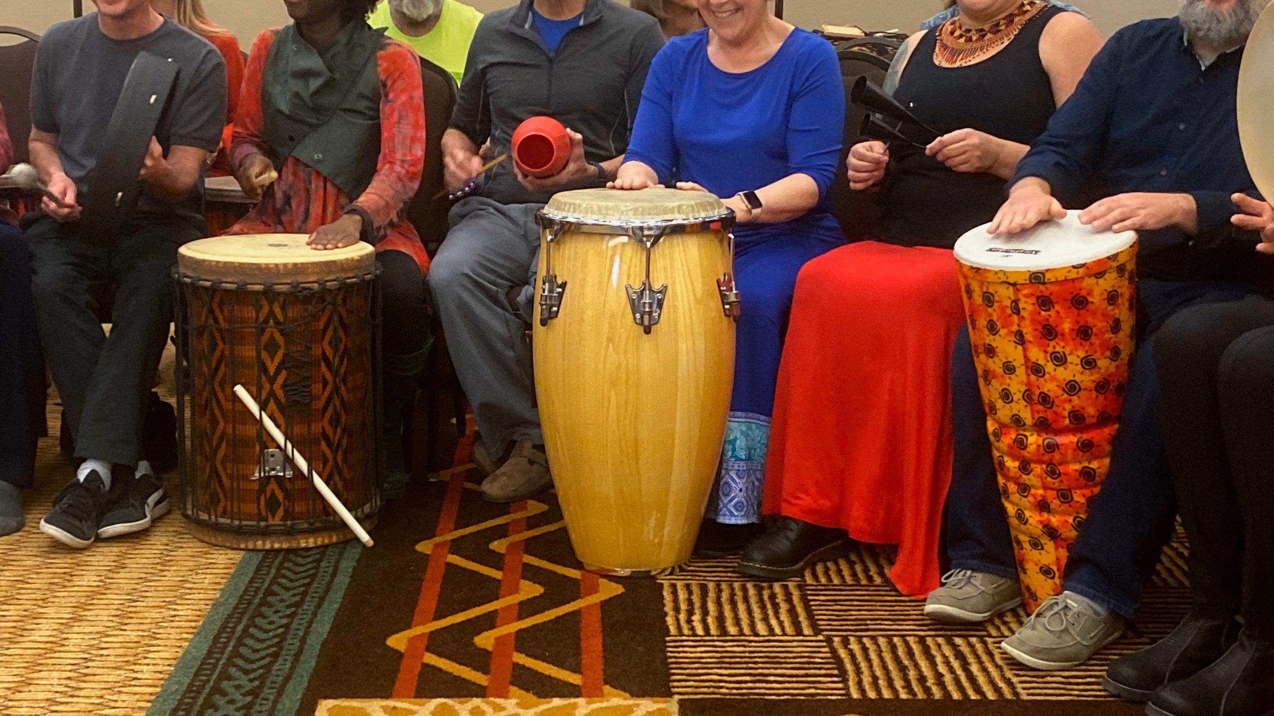 group of people drumming instruments